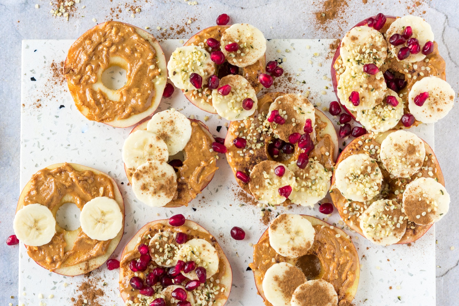 Veggipedia - Apple slices with nut butter, banana, cinnamon and hemp seeds