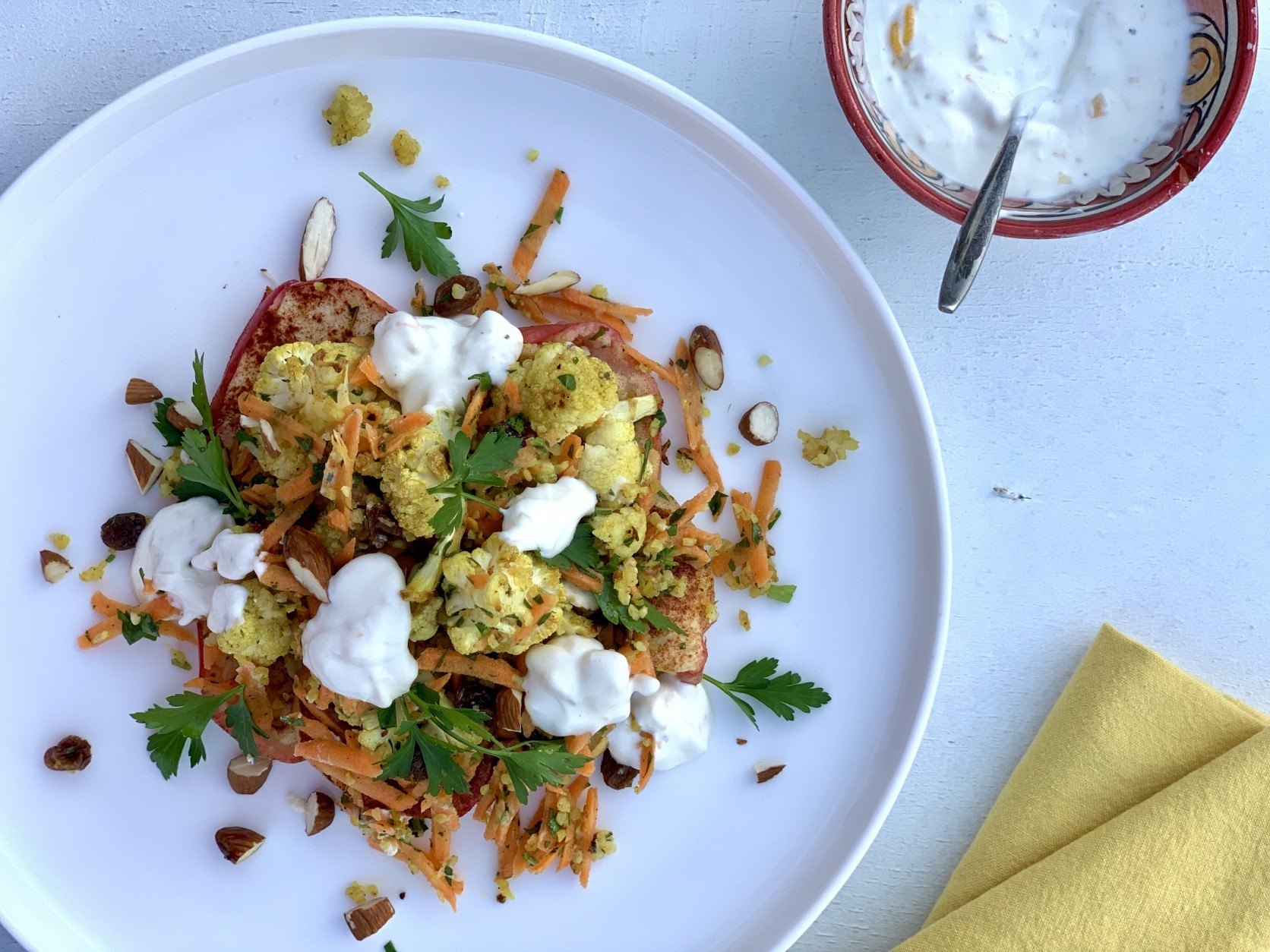 Veggipedia - Roasted bulgur with almonds, cauliflower, apple slices and lemon labne by Sandra Ysbran